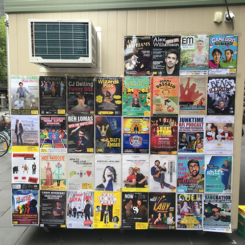 Posters on the MICF info booth outside Melbourne Town Hall, 24 March 2016